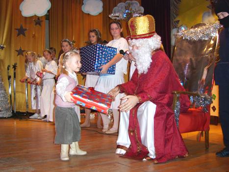 St Nicholas hands out a present