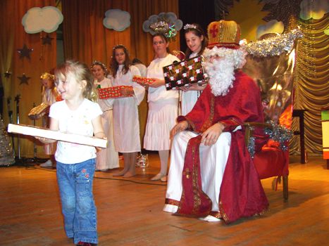 St Nicholas hands out a present