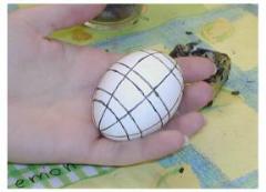 Pysanky: wax lines have been drawn on the white egg, which is ready to go in to the first dye.  Anything covered in wax at this stage will remain white