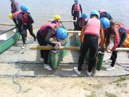 Youths building rafts